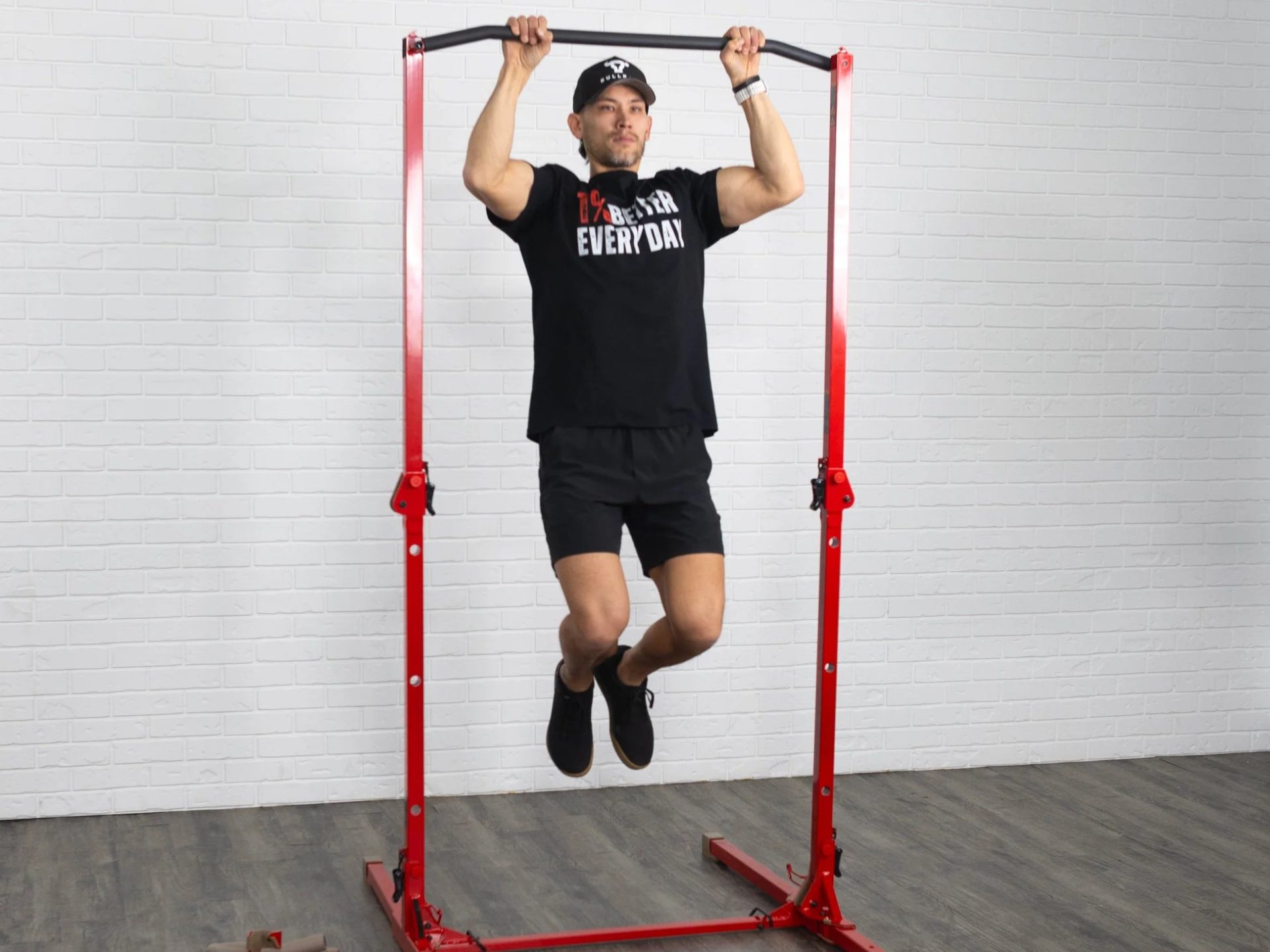 Man doing pull ups on BULLBAR workout station for tiny spaces