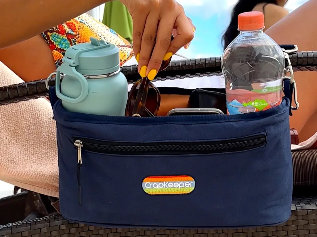 CrapKeeper strapped to beach chair with objects inside