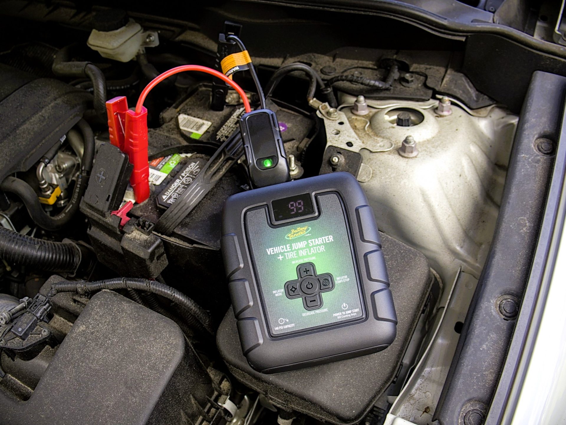 Battery Tender 800 amp jump starter and tire inflator hooked up to battery
