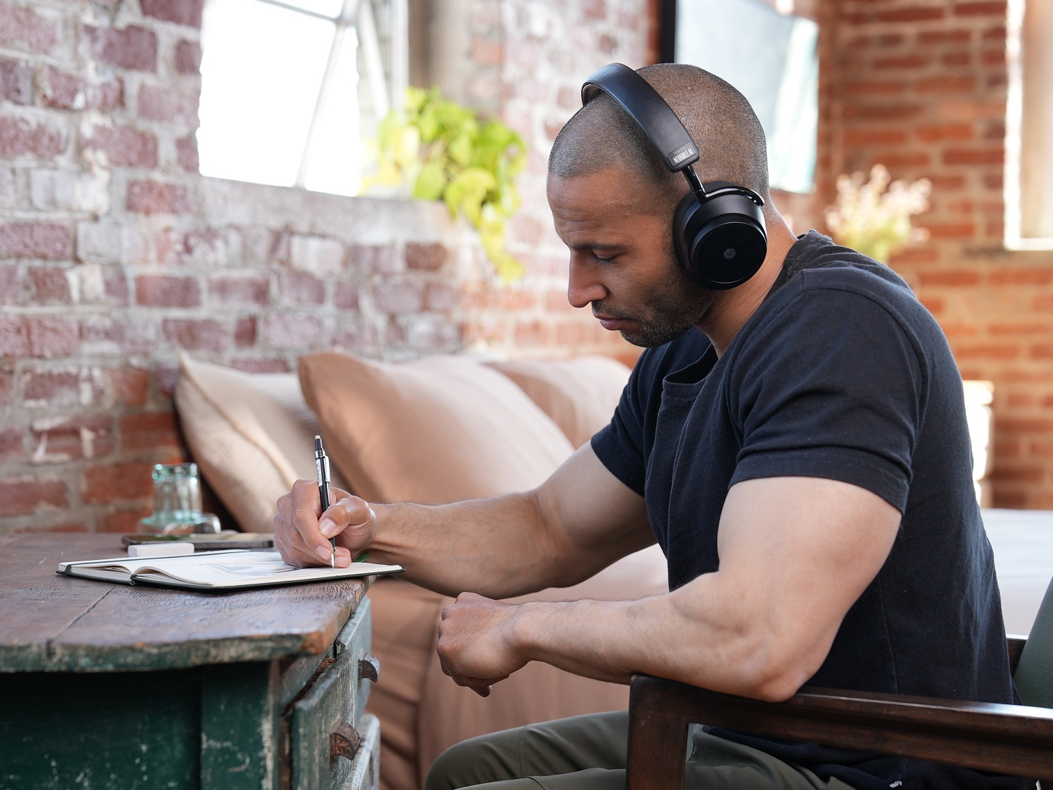 Neurable MW75 Neuro LT 6 worn while writing at a desk