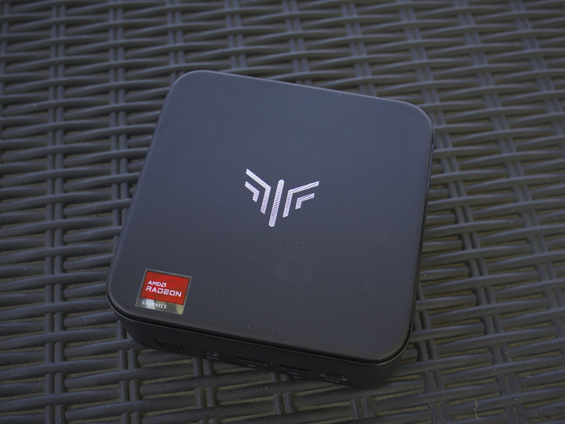 Kamrui E3B Mini PC with AMD on black background