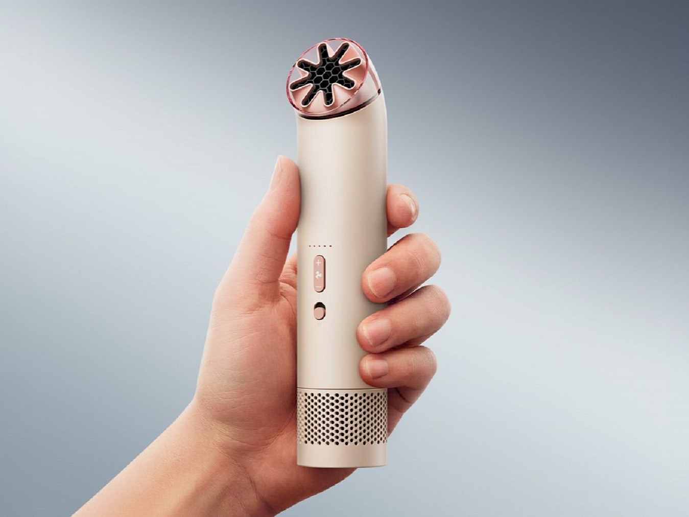 Dyson HushJet Mini Cool portable evaporative cooling gadget held in hand