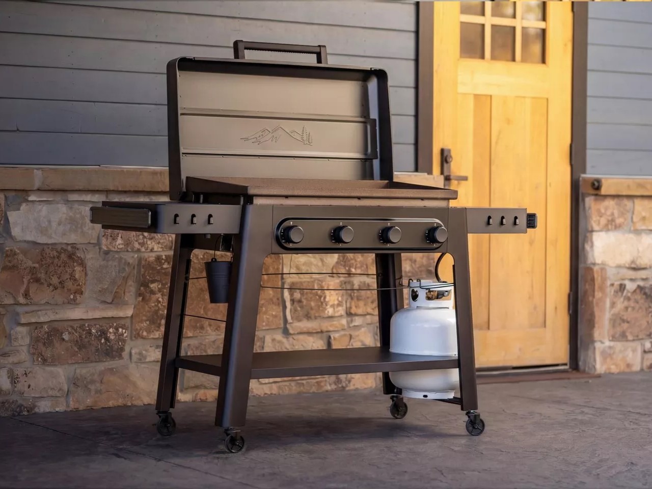Traeger Irontop Series flattop grilling setup with four-burners on porch
