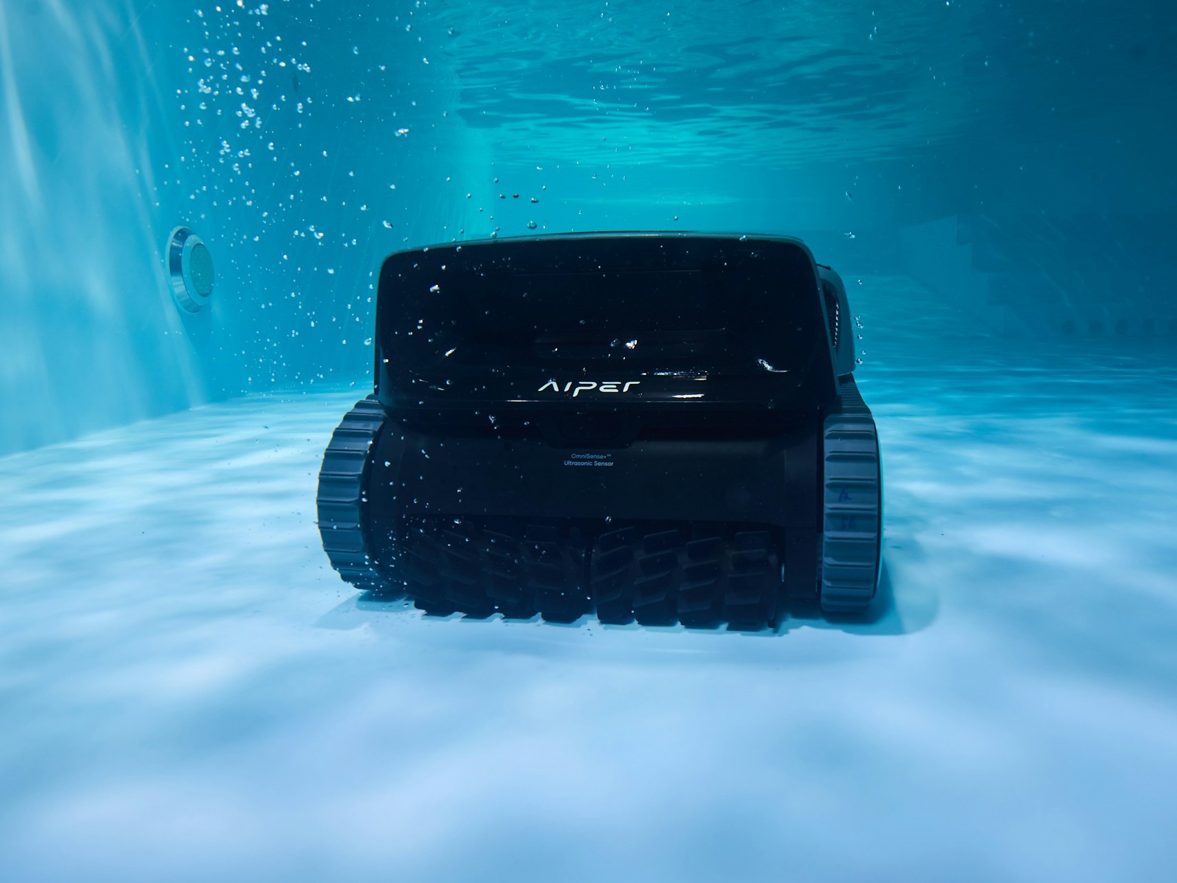 Aiper smart pool vacuum cleaning a pool floor